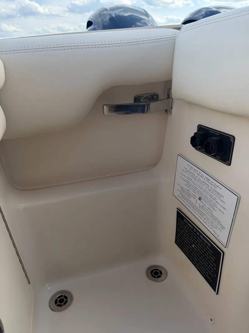 Slide: The Image of Close-up of a white boat seat with stainless steel handle and ventilation grilles. - 27