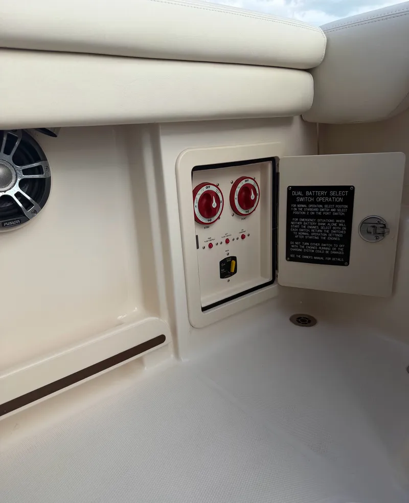 Slide: The Image of The image shows the battery selector switch area of a 2022 Grady-White Freedom 275. - 26