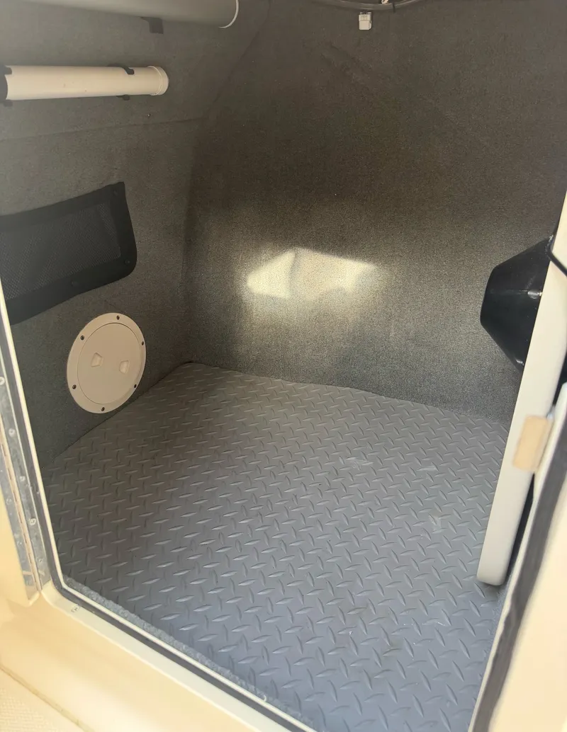 Slide: The Image of Interior of the 2022 Grady-White Freedom 275 with gray flooring. - 22