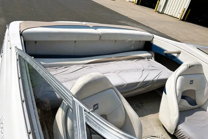 Slide: The Image of Interior of a 1997 Four Winns 170 Horizon boat with seating and upholstery. - 10