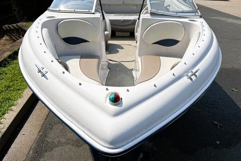 Slide: The Image of 1997 Four Winns 170 Horizon boat with white seating and navigation light. - 7