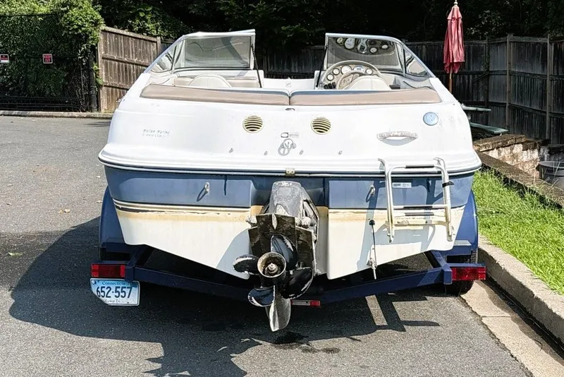 Slide: The Image of 1997 Four Winns 170 Horizon boat on trailer, parked outdoors, rear view. - 3