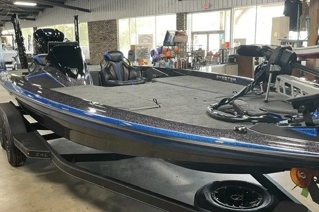 Slide: The Image of 2027 Skleeter ZXE20 boat with sleek design and modern features in showroom. - 13