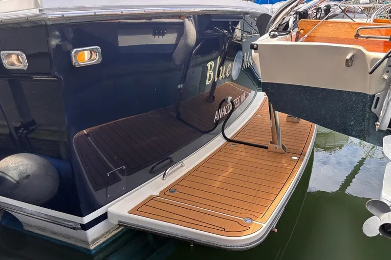 Slide: The Image of 2000 Sabreline 47 yacht with teak swim platform, docked at marina. - 18