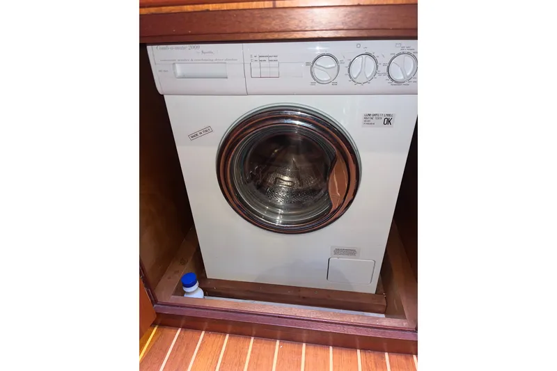 Slide: The Image of Washing machine in a Sabreline 47 yacht, 2000 model, with wooden cabinetry. - 26