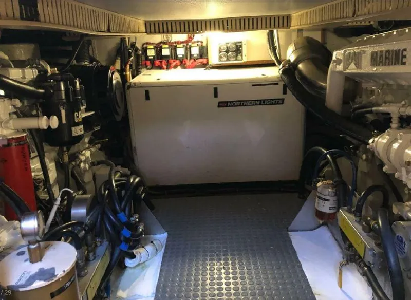 Slide: The Image of Engine room of a 2000 Sabreline 47 with well-organized machinery and equipment. - 24
