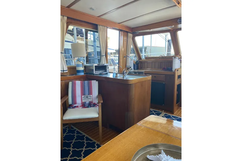 Slide: The Image of Interior of 2000 Sabreline 47 yacht with wooden cabinetry and nautical decor. - 31