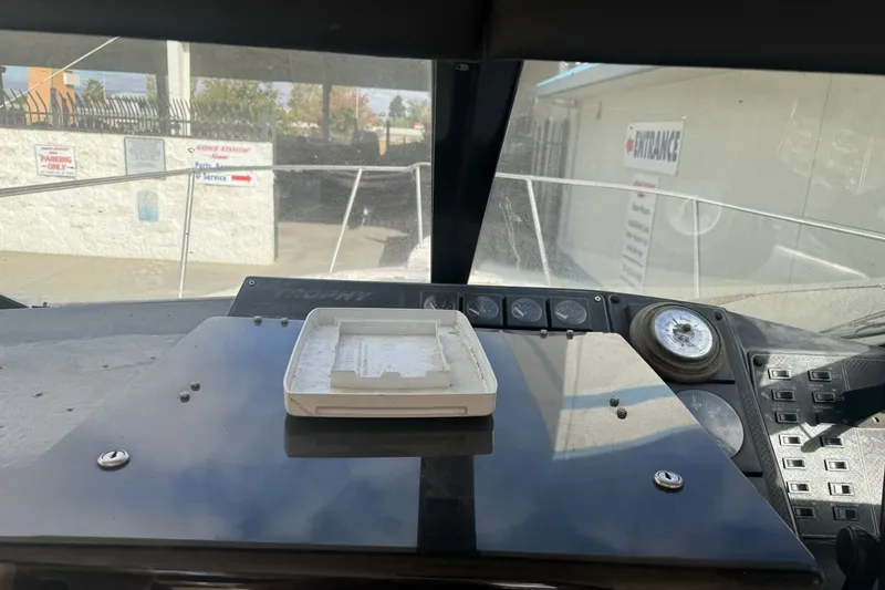Slide: The Image of Interior view of a 1995 Bayliner 2302 Trophy Walkaround boat dashboard. - 22