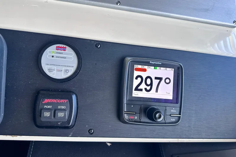 Slide: The Image of Control panel of a 2014 Sea Ray 510 Fly with navigation and fire suppression systems. - 19