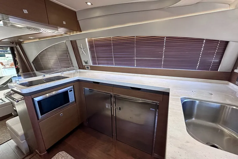 Slide: The Image of Luxurious kitchen interior of 2014 Sea Ray 510 Fly yacht with modern appliances and sleek design. - 6