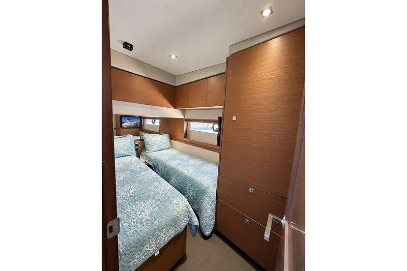 Slide: The Image of Luxurious twin cabin interior of 2014 Sea Ray 510 Fly yacht with modern wood finish. - 35