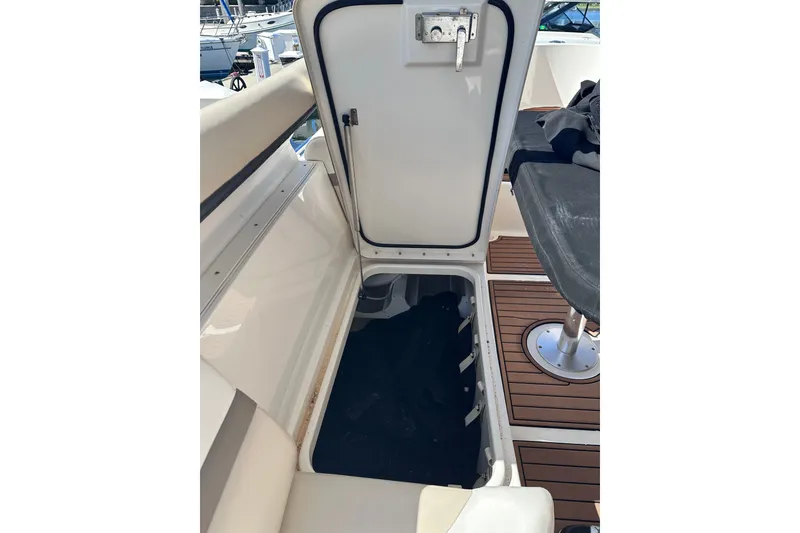 Slide: The Image of 2014 Sea Ray 510 Fly yacht interior hatch with seating and wooden flooring. - 49
