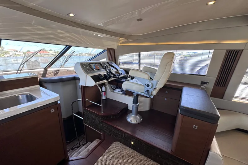 Slide: The Image of Luxurious helm station of 2014 Sea Ray 510 Fly yacht with modern controls and seating. - 16