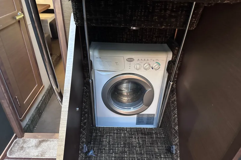 Slide: The Image of Washing machine inside 2014 Sea Ray 510 Fly yacht's interior compartment. - 24