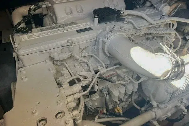 Slide: The Image of Engine of a 2014 Sea Ray 510 Fly yacht, showcasing intricate mechanical components. - 53