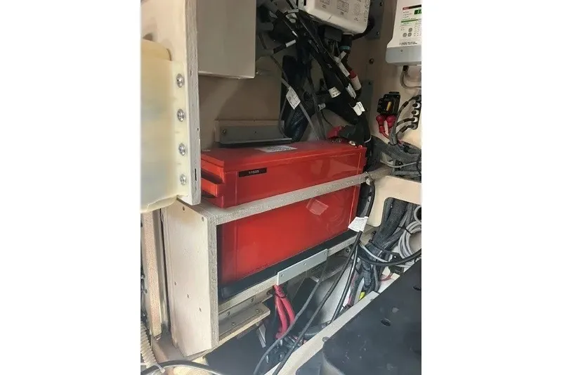 Slide: The Image of Engine compartment of a 2014 Sea Ray 510 Fly with visible battery and wiring. - 52