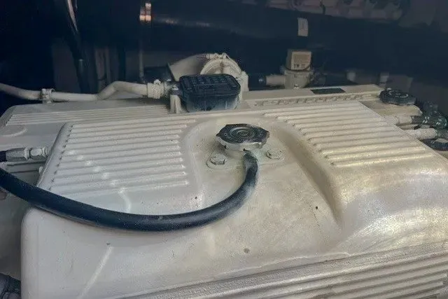 Slide: The Image of Engine compartment of a 2014 Sea Ray 510 Fly yacht, showcasing mechanical components. - 54
