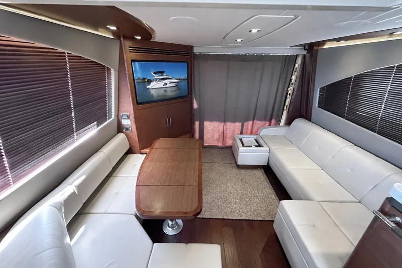 Slide: The Image of Luxurious interior of 2014 Sea Ray 510 Fly yacht with modern seating and entertainment system. - 5