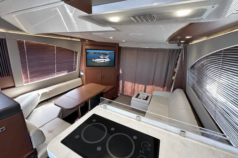 Slide: The Image of Luxurious interior of 2014 Sea Ray 510 Fly yacht with modern seating and entertainment area. - 3