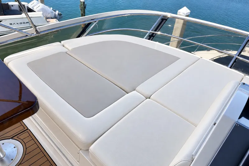 Slide: The Image of Luxurious sunbathing deck on 2014 Sea Ray 510 Fly yacht, overlooking serene blue waters. - 41