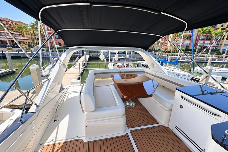 Slide: The Image of Luxurious 2014 Sea Ray 510 Fly yacht with spacious flybridge and elegant seating area. - 37