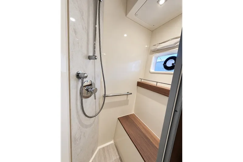 Slide: The Image of Luxurious shower area in 2014 Sea Ray 510 Fly yacht, featuring modern fixtures and seating. - 29