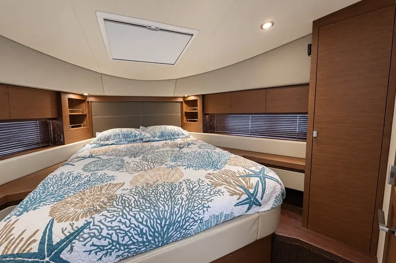 Slide: The Image of Luxurious bedroom interior of 2014 Sea Ray 510 Fly yacht with elegant bedding. - 32