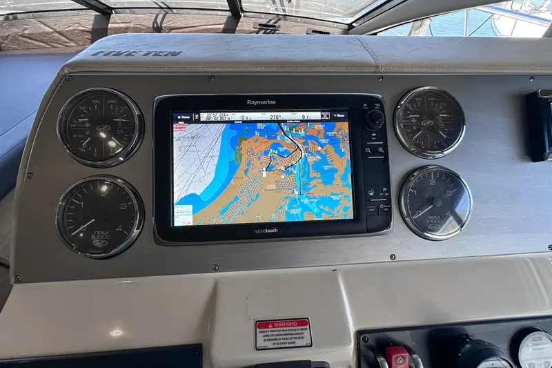 Slide: The Image of Dashboard of 2014 Sea Ray 510 Fly with navigation system and gauges. - 21