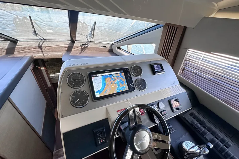 Slide: The Image of Helm of 2014 Sea Ray 510 Fly yacht with navigation display and controls. - 20