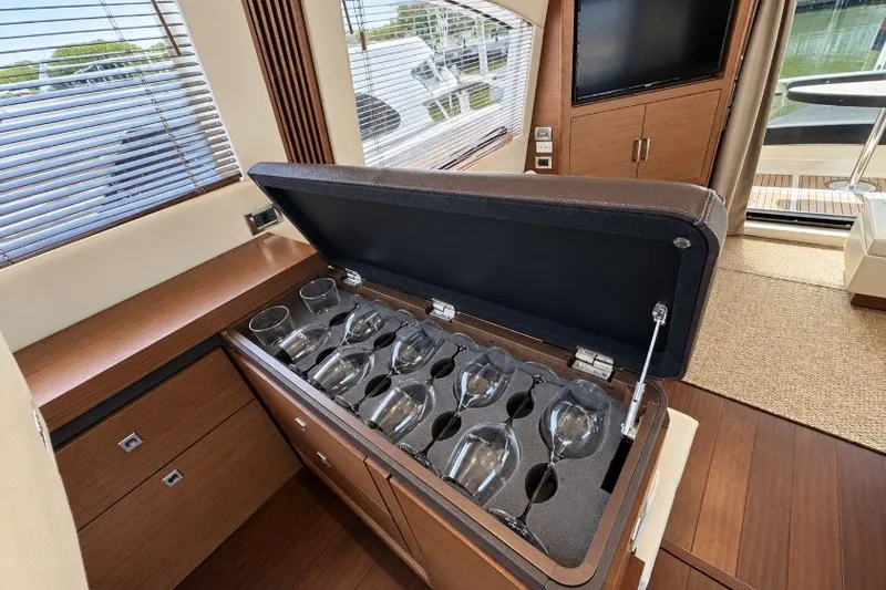 Slide: The Image of Luxurious interior of 2014 Sea Ray 510 Fly yacht with wine glass storage. - 11