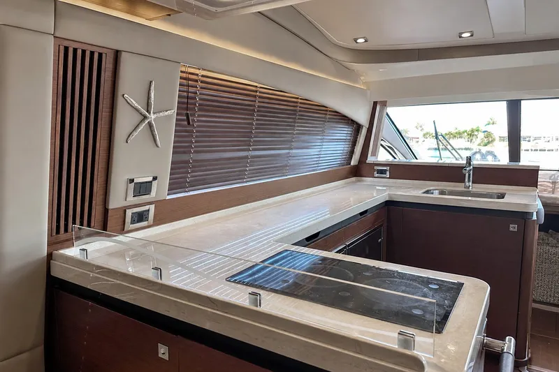 Slide: The Image of Luxurious kitchen interior of 2014 Sea Ray 510 Fly yacht with modern amenities. - 7