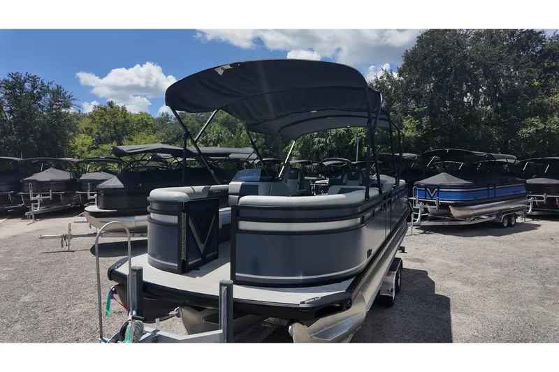 Slide: The Image of Pontoon boat Viaggio x20u 2027 model, parked outdoors under a clear sky. - 16