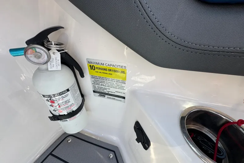 Slide: The Image of Fire extinguisher and capacity label on 2020 Chaparral Vortex 223 VRX boat interior. - 17