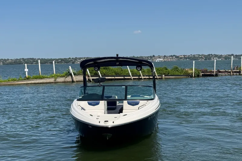 Slide: The Image of 2020 Chaparral Vortex 223 VRX boat on calm water with scenic background. - 3
