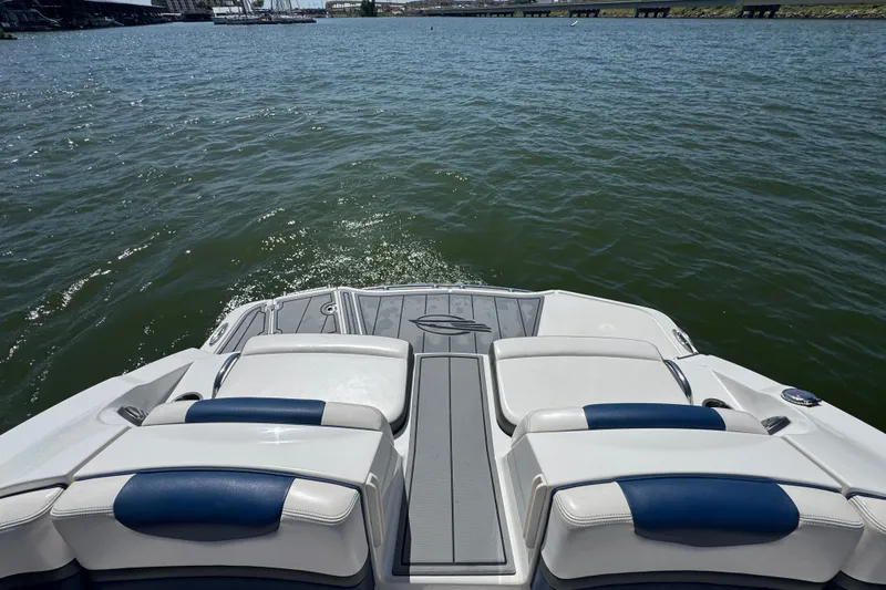Slide: The Image of 2020 Chaparral Vortex 223 VRX boat on water, rear seating view. - 23