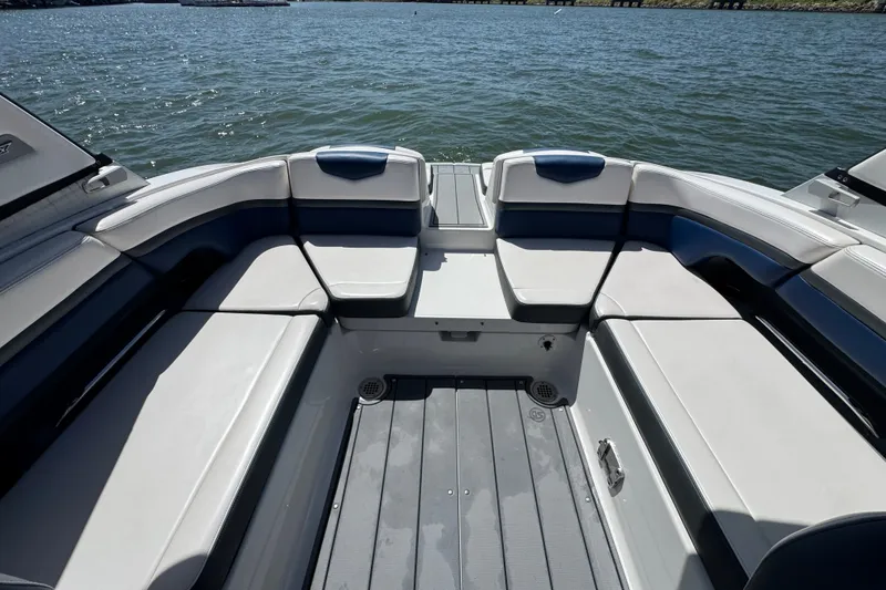 Slide: The Image of 2020 Chaparral Vortex 223 VRX boat interior with spacious seating on the water. - 22