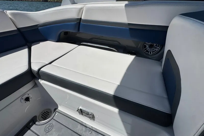 Slide: The Image of 2020 Chaparral Vortex 223 VRX boat interior seating with blue and white upholstery. - 21
