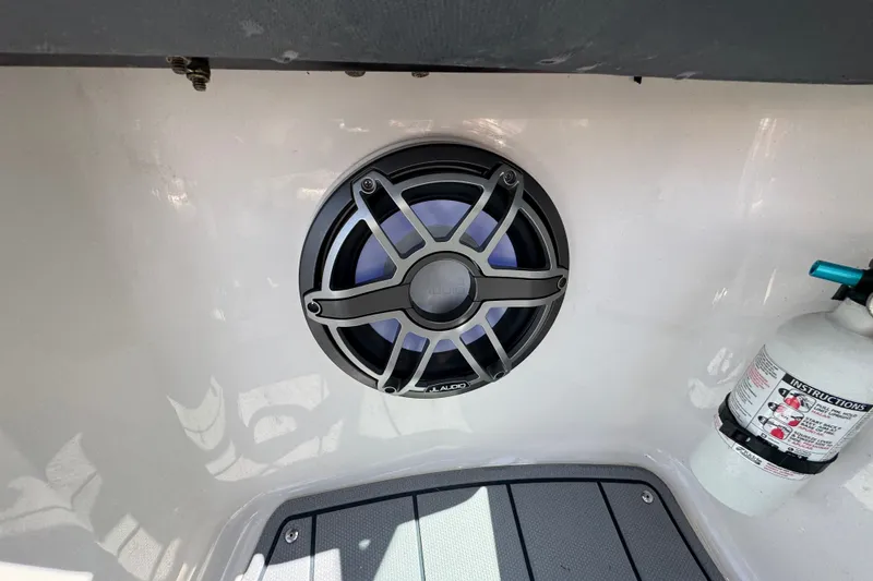 Slide: The Image of 2020 Chaparral Vortex 223 VRX boat speaker and fire extinguisher on white interior. - 18