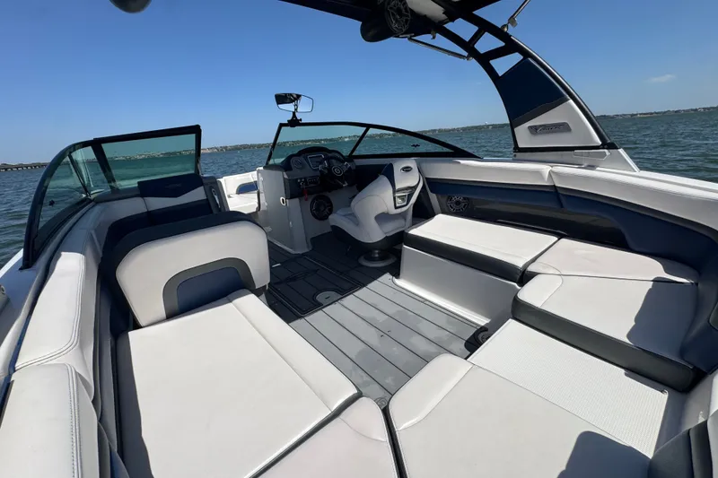 Slide: The Image of 2020 Chaparral Vortex 223 VRX boat interior with sleek seating and modern dashboard. - 27