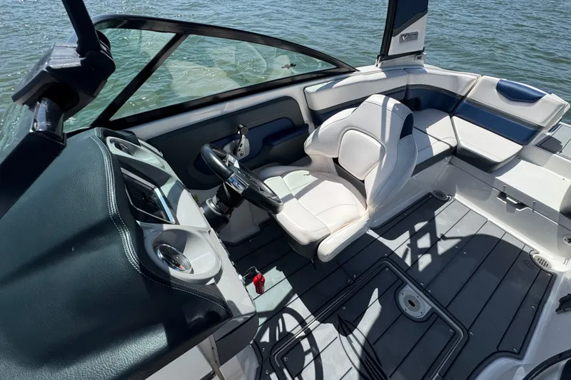 Slide: The Image of 2020 Chaparral Vortex 223 VRX boat interior with sleek seating and modern dashboard. - 13