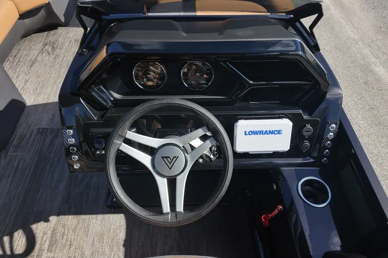 Slide: The Image of Viaggio x20u 2027 boat dashboard with steering wheel and Lowrance navigation system. - 16