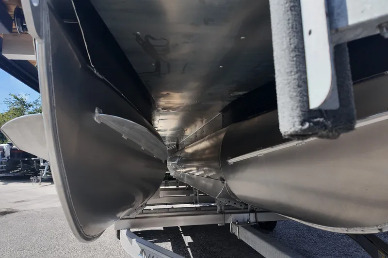 Slide: The Image of Underneath view of a 2027 Viaggio x20u pontoon boat on a trailer. - 13