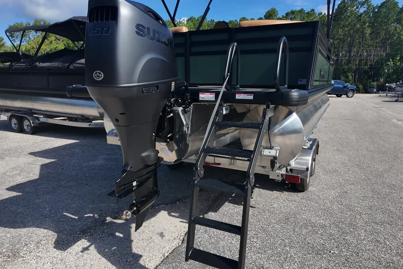 Slide: The Image of Pontoon boat with Suzuki outboard motor, Viaggio x20u 2027 model, parked on trailer. - 18