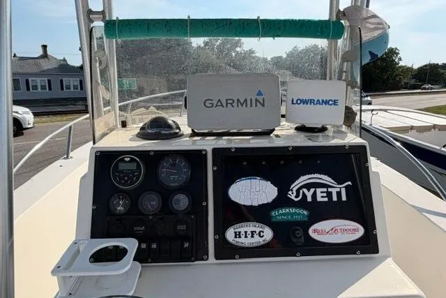 Slide: The Image of Center console of a 2000 KenCraft Challenger 206 with Garmin and Lowrance equipment. - 9