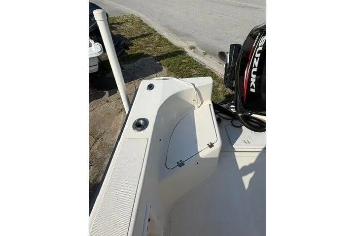 Slide: The Image of KenCraft Challenger 206 boat, 2000 model, featuring a Suzuki outboard motor, docked on a sunny day. - 5