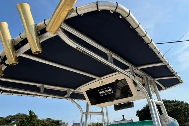 Slide: The Image of KenCraft Challenger 206 boat T-top with rod holders and Pelican storage, 2000 model. - 16