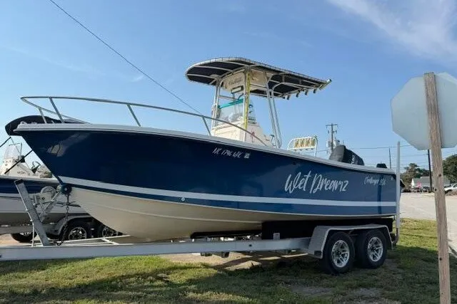 The Image of 2000 KenCraft Challenger 206 boat on trailer, blue hull, "Wet Dreamz" text on side. - 0