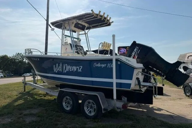 Slide: The Image of 2000 KenCraft Challenger 206 boat on trailer, featuring "Wet Dreamz" name and Suzuki outboard motor. - 1