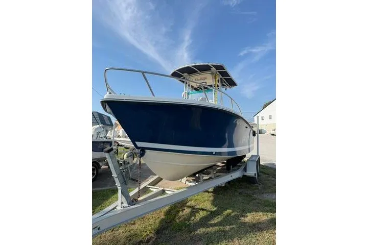 Slide: The Image of 2000 KenCraft Challenger 206 boat on trailer under clear blue sky. - 2