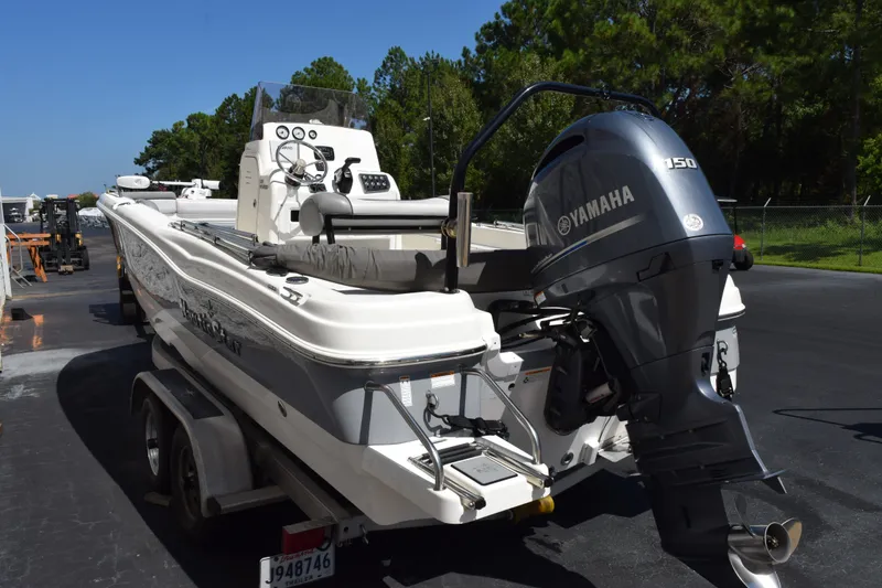 Slide: The Image of 2021 NauticStar 211 Hybrid boat with Yamaha 150 engine on trailer. - 5